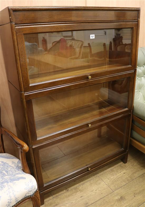 An oak three section glazed bookcase, W.87cm